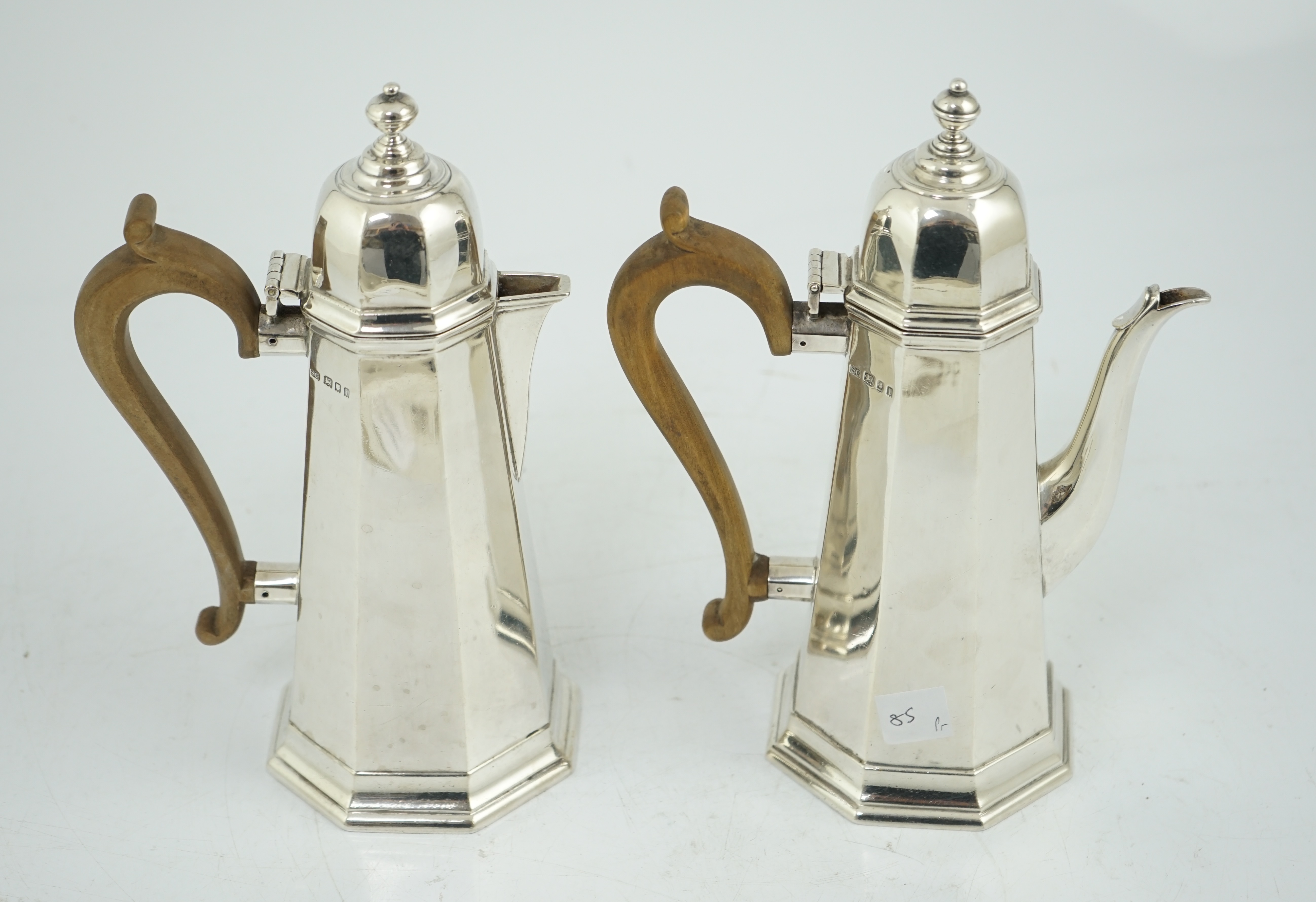 A George V 18th century style silver cafe au lait pair by Garrard & Co